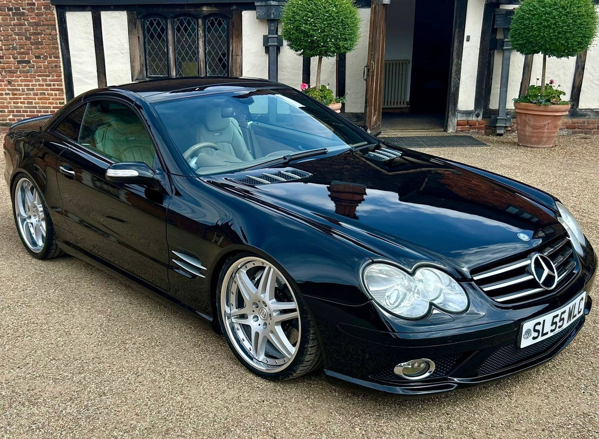 Black Mercedes-Benz SL R230 with custom wheels