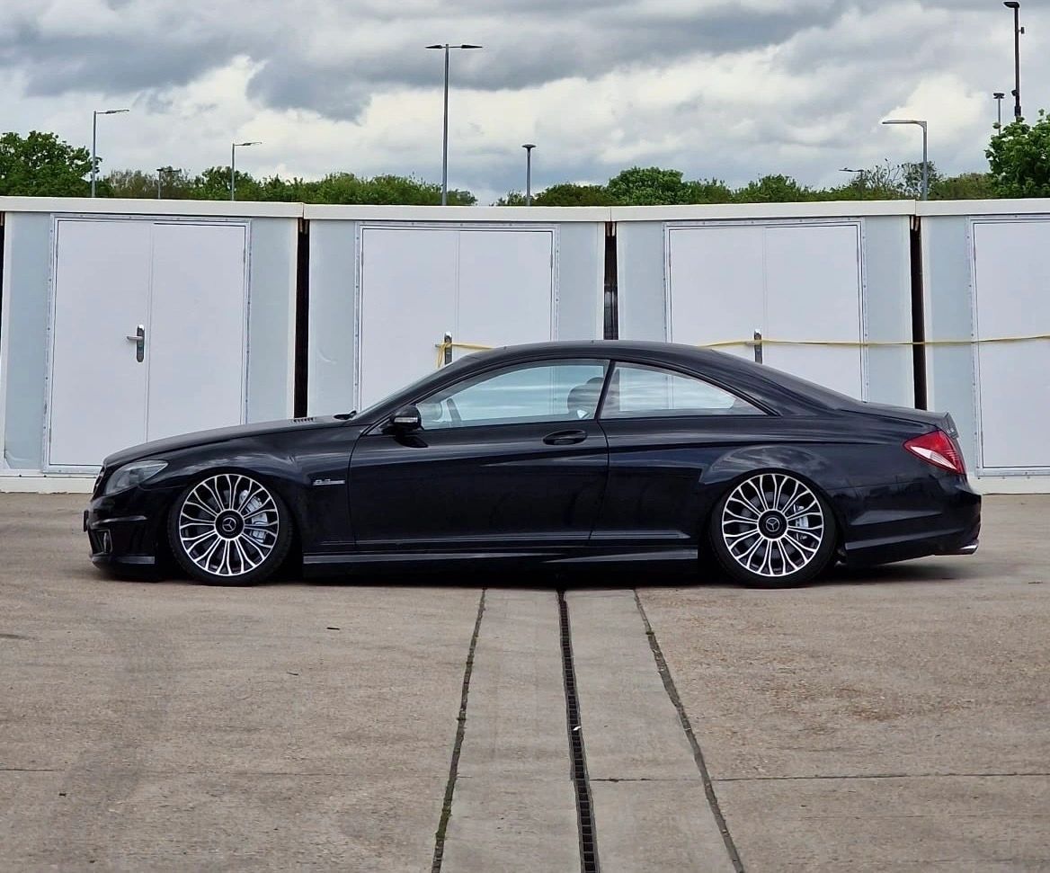 Dark Mercedes-Benz CL-Class C216 with custom wheel fitment