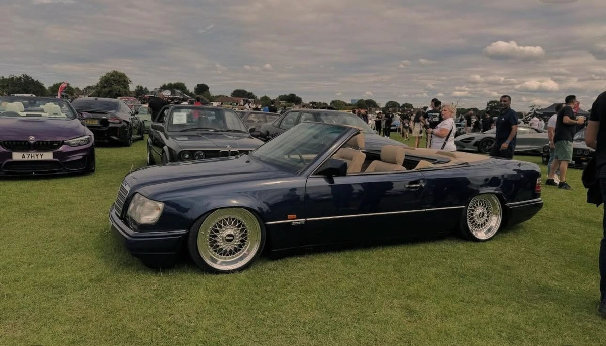 Black Mercedes-Benz A124 Cabriolet on custom wheels